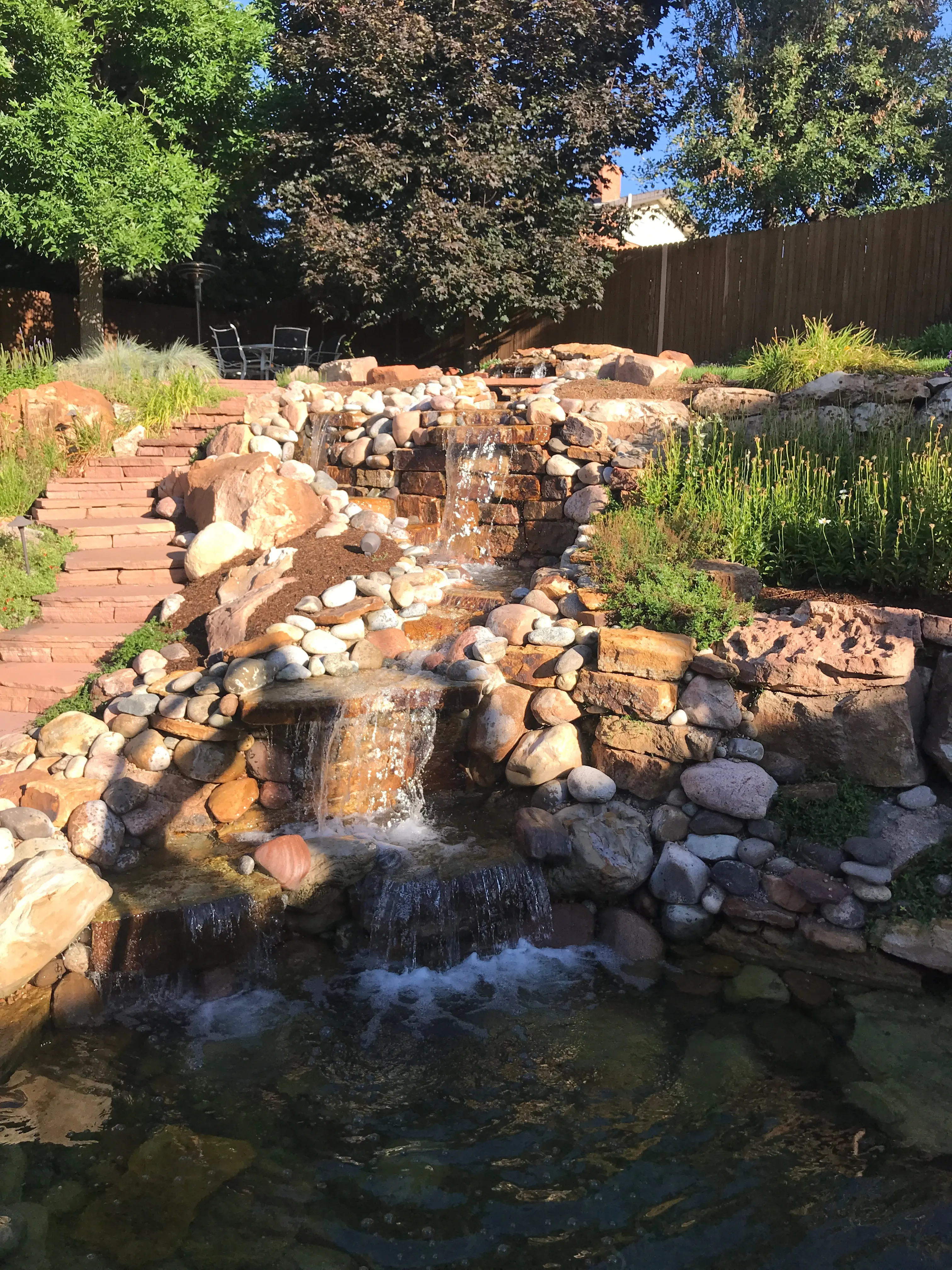 small lagoon with tall water falls